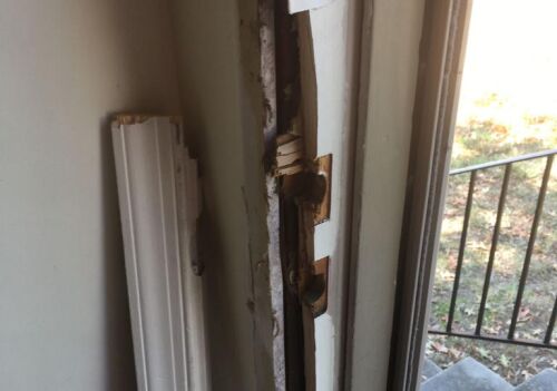 Damaged door jamb showing wear and tear, highlighting the need for door frame replacement services in Northwest Washington.