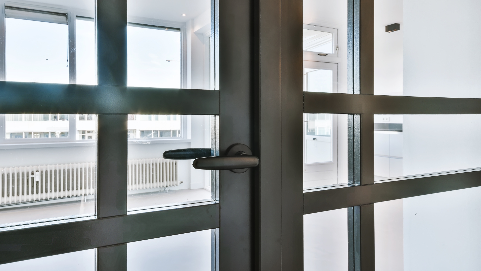 An interior aluminum and glass door in a building