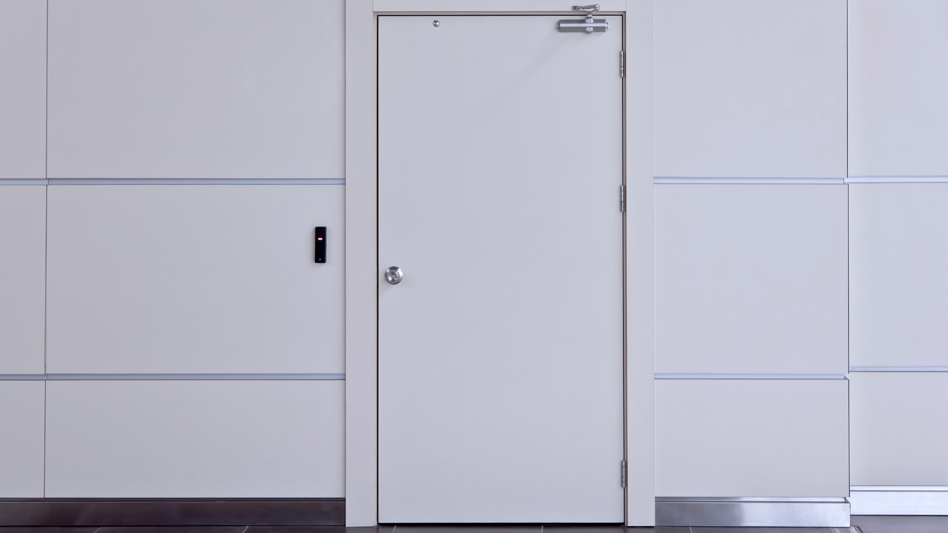 A steel door in white finish