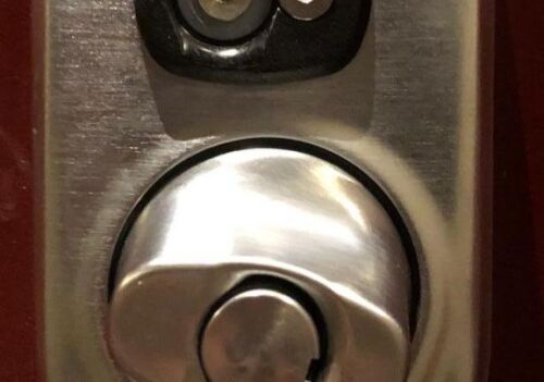 Smart lock close-up showing keyhole and electronic keypad, relevant to smart lock repair services in Arlington, VA.