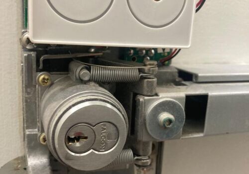 Commercial door lock mechanism with electronic components, showcasing security features relevant to commercial locksmith services in Washington, DC.