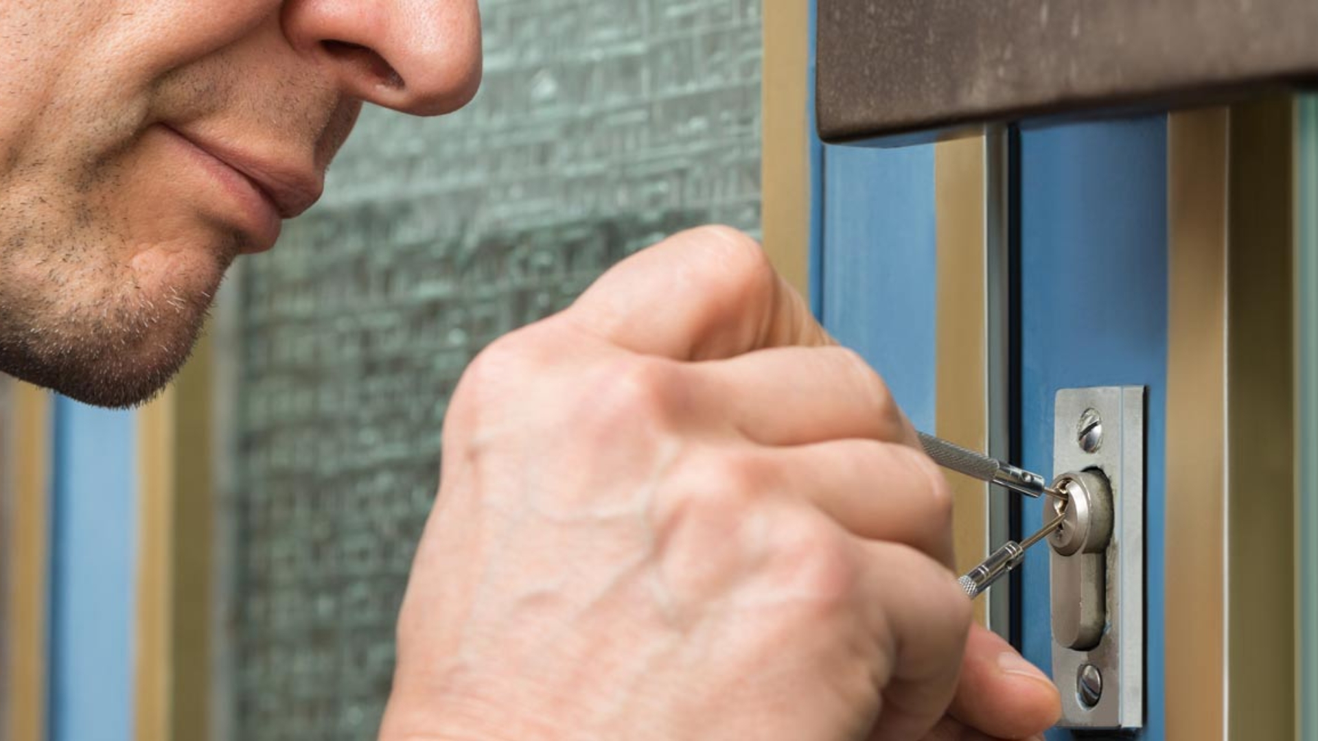 A locksmith performing a broken key extraction service
