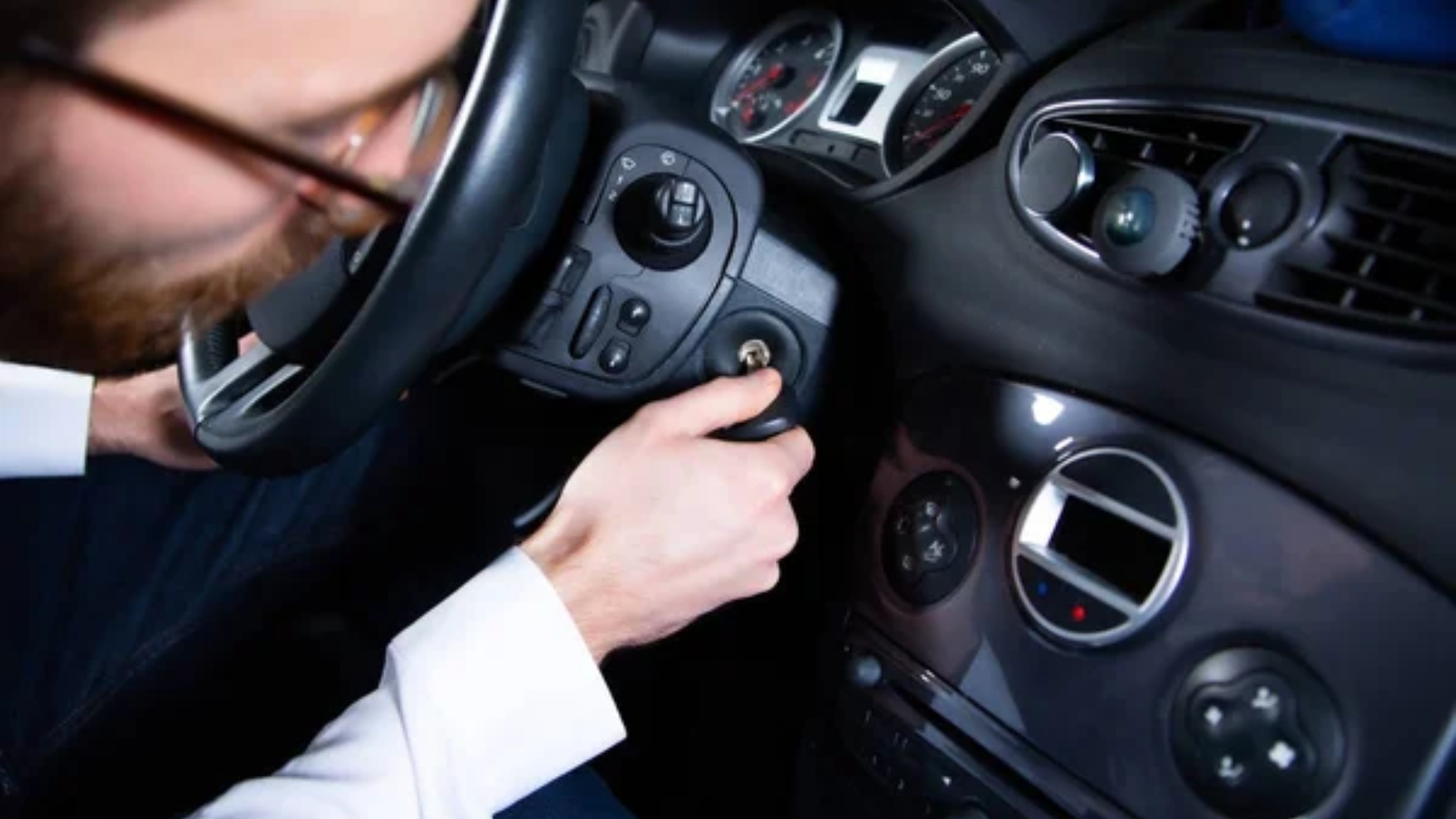 A driver turning the ignition switch on