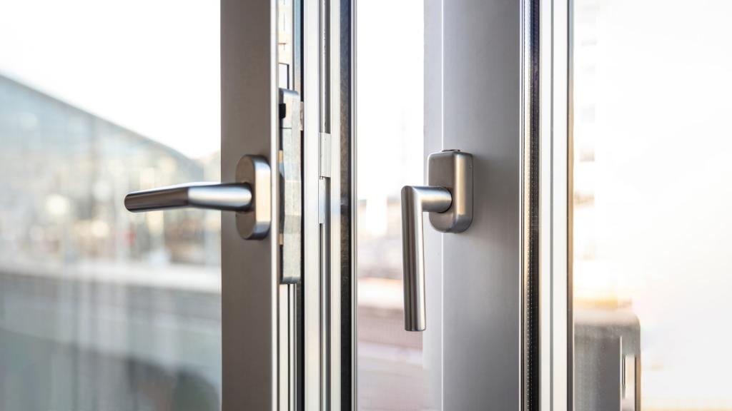 A technician repairing an aluminum door lock in Bethesda, MD