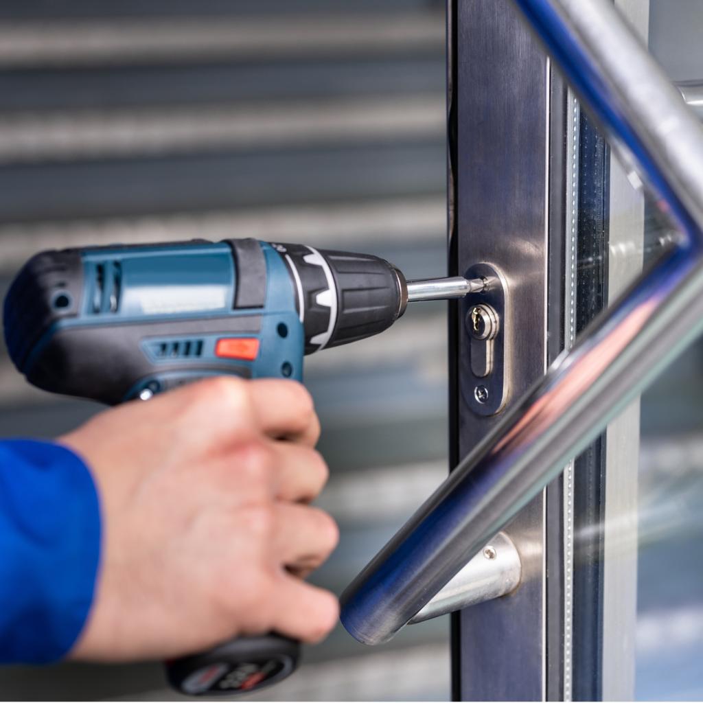 Commercial locksmith repairing door hardware near Old Town Alexandria