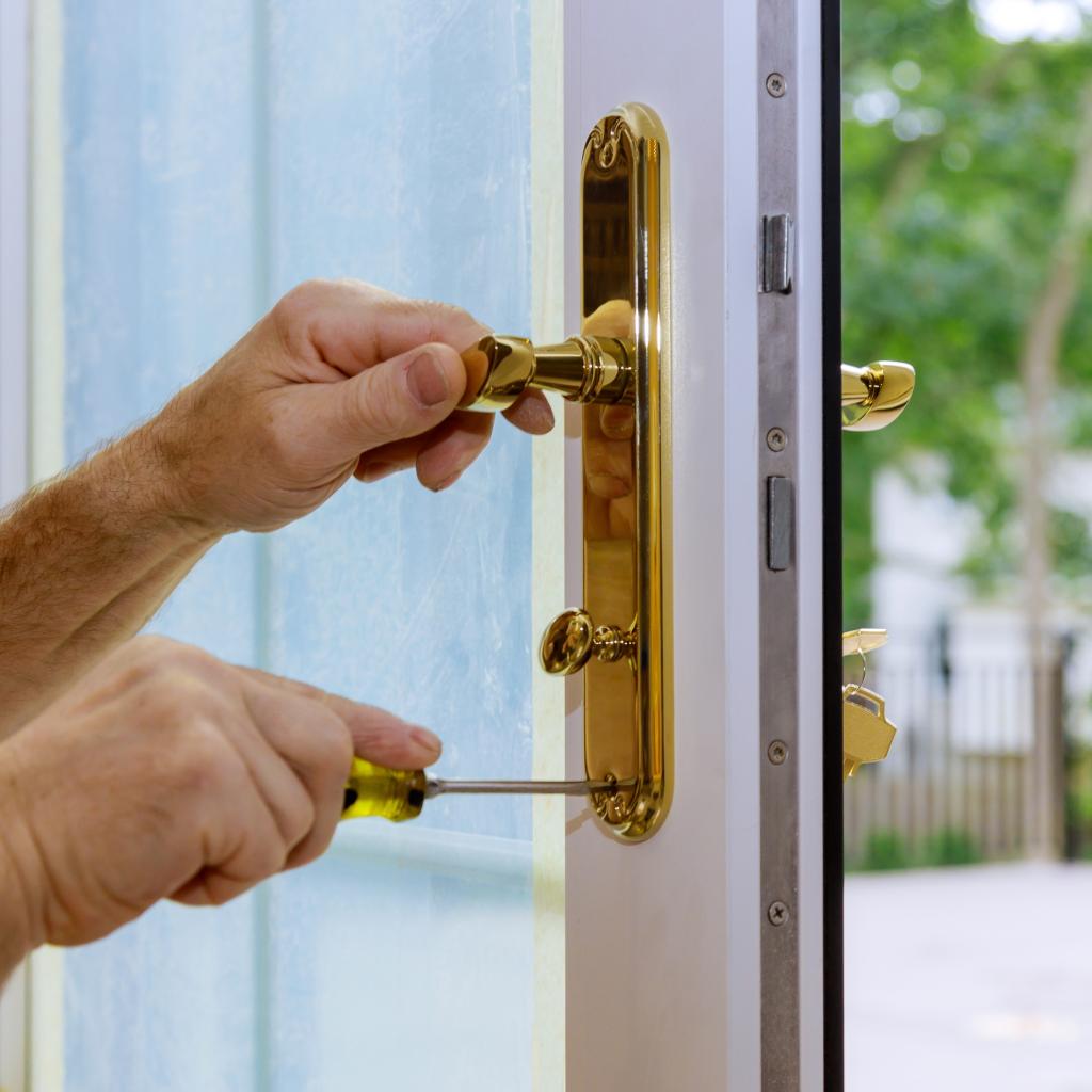 Technician replacing mortise lock in a Potomac single-family home