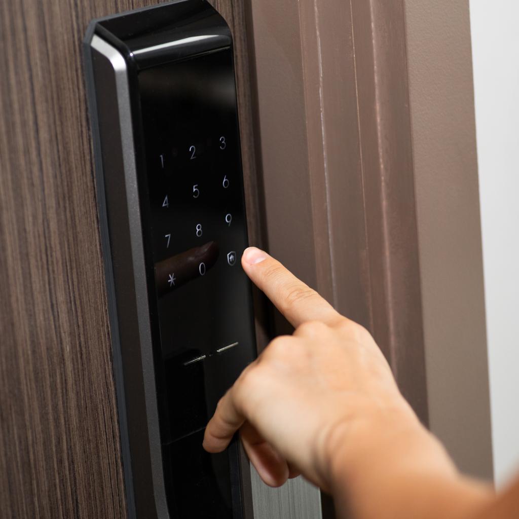 Professional locksmith completing keyless entry lock installation in Virginia